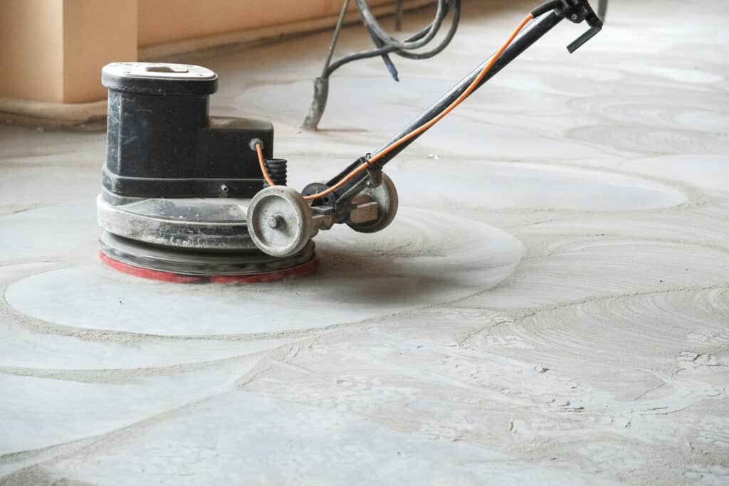 The Ins and Outs of Removing Garage Floor Coatings Removing Garage Floor Coatings with a grinder