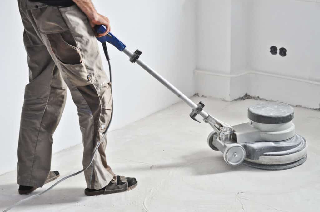 The Ins and Outs of Removing Garage Floor Coatings Removing Garage Floor Coatings with an industrial grinder